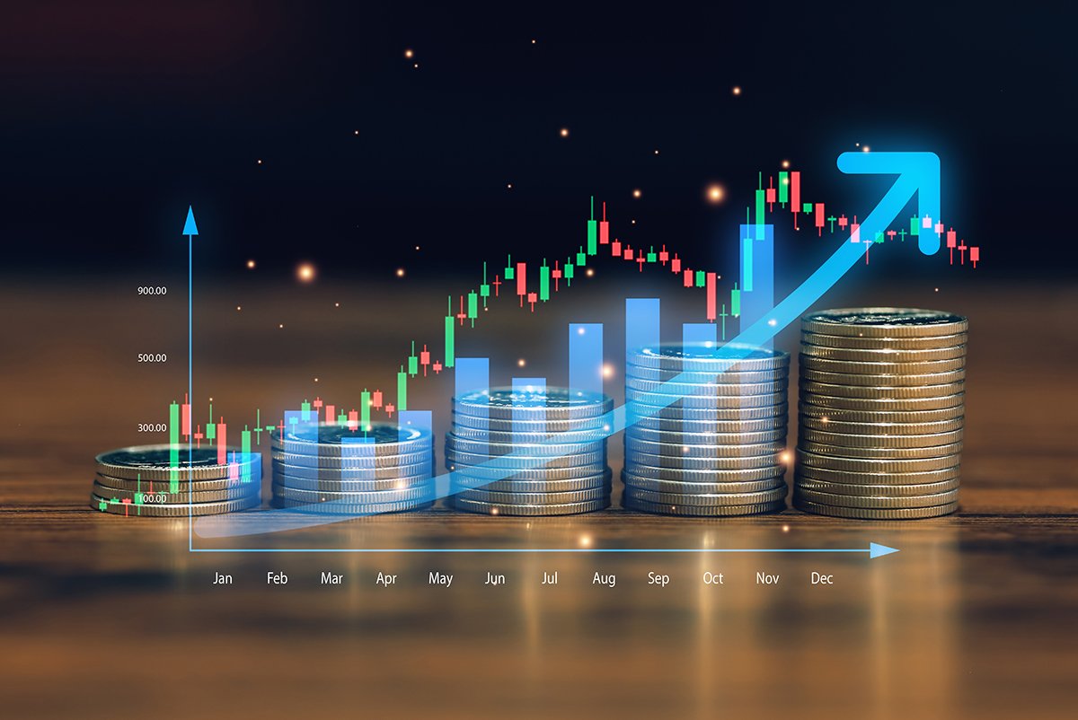 financial,growth,concept,with,stacked,coins,and,rising,stock,market
